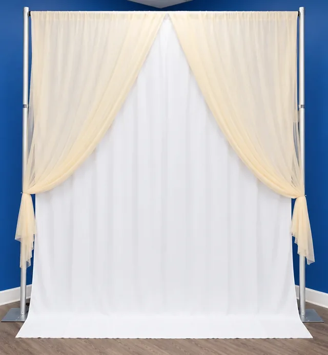 Champagne sheer drapes tied back over white