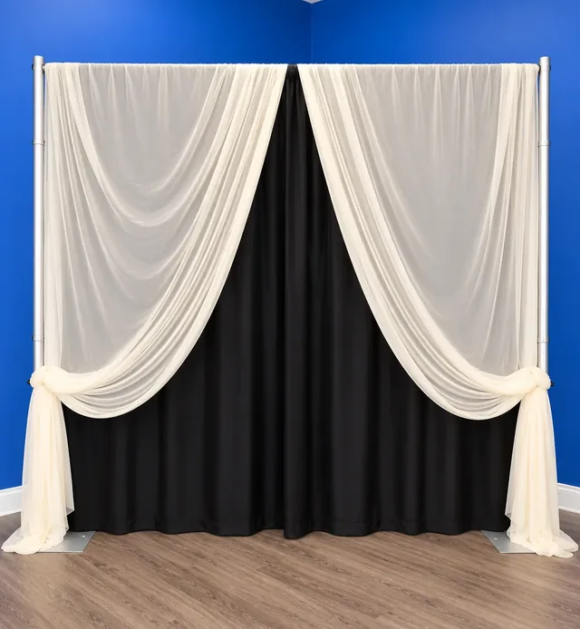 Ivory sheer drapes tied back over black
